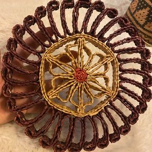 Sold. Weaved straw plant coaster